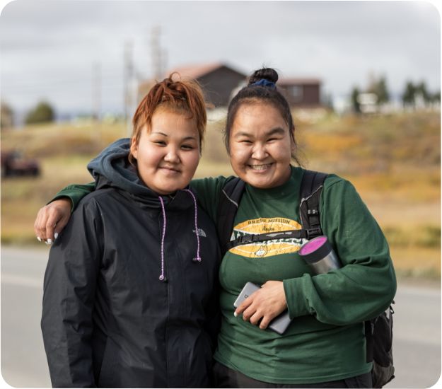 2 Alaska Native Women hugging